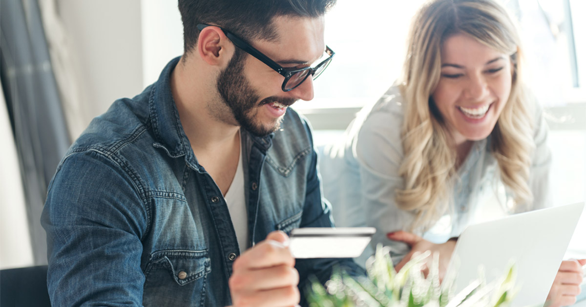 people smiling with card